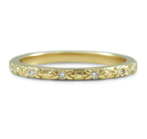 14k yellow, rose or white gold flower engraved wedding band with round bezel set diamonds around the band