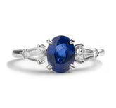 14k white gold 1.60ct oval cut blue sapphire shield cut side stones ring