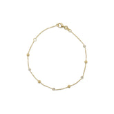 7 inch adjustable 14k yellow gold alternating diamond and gold bead station bracelet