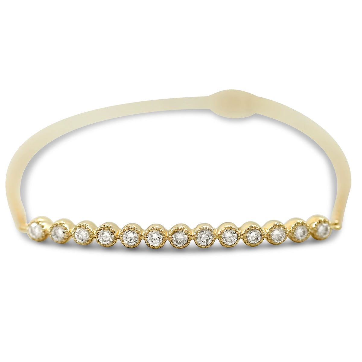14k yellow gold diamond bracelet bezel set with milgrain details 7in long