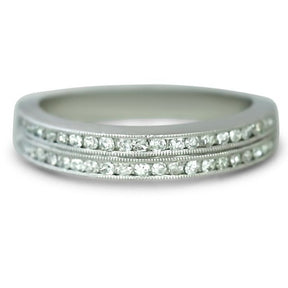platinum channel set double row estate diamond wedding band with knife edges and milgrain details.