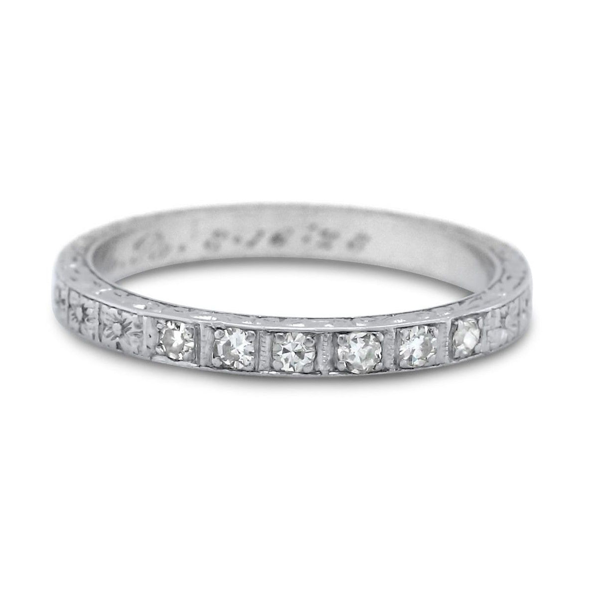 Platinum bezel set diamond and flower engraved patter antique eternity wedding band