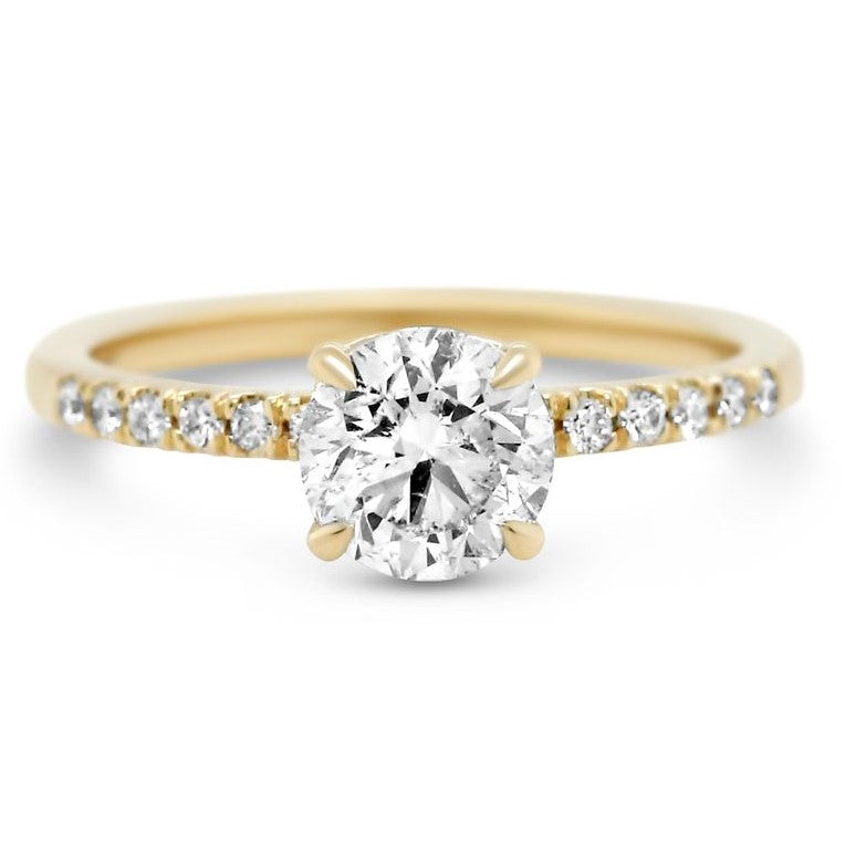 14k yellow gold round brilliant cut diamond engagement ring with diamonds on the band and petal prongs ready to go 